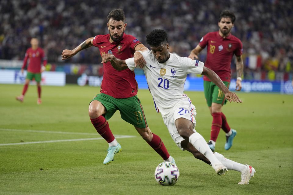 Soccer Football - Euro 2020 - Group F - Portugal v France - Puskas Arena, Budapest, Hungary - June 23, 2021 France's Kingsley Coman in action with Portugal's Bruno Fernandes. Photo: Pool via Reuters