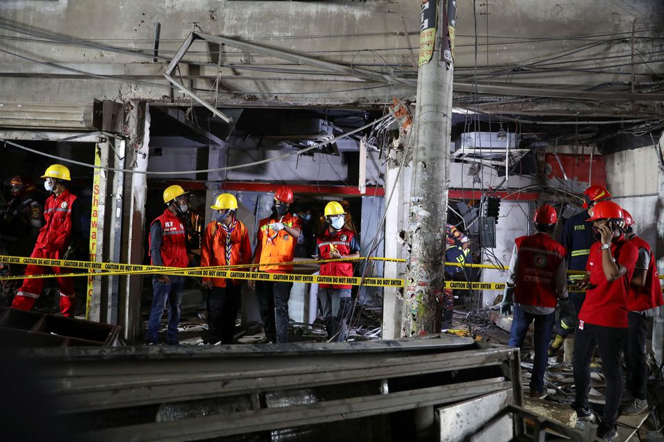 Rescue workers inspect the site after a blast in a shop that killed several people in Dhaka, Bangladesh, June 27, 2021. Photo: Reuters