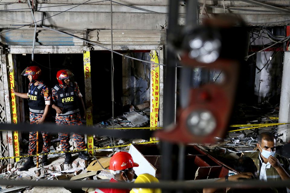 Rescue workers inspect the site after a blast in a shop that killed several people in Dhaka, Bangladesh, June 27, 2021. Photo: Reuters