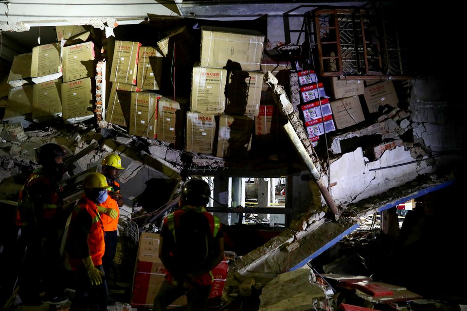 Rescue workers inspect the site after a blast in a shop that killed several people in Dhaka, Bangladesh, June 27, 2021. Photo: Reuters