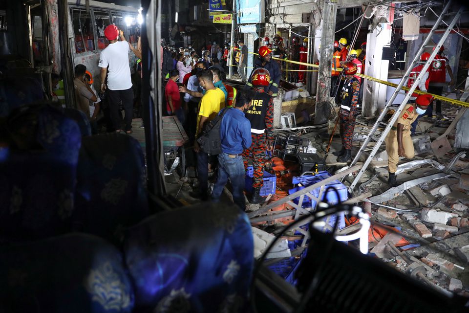 Rescue workers inspect the site after a blast in a shop that killed several people in Dhaka, Bangladesh, June 27, 2021. Photo: Reuters