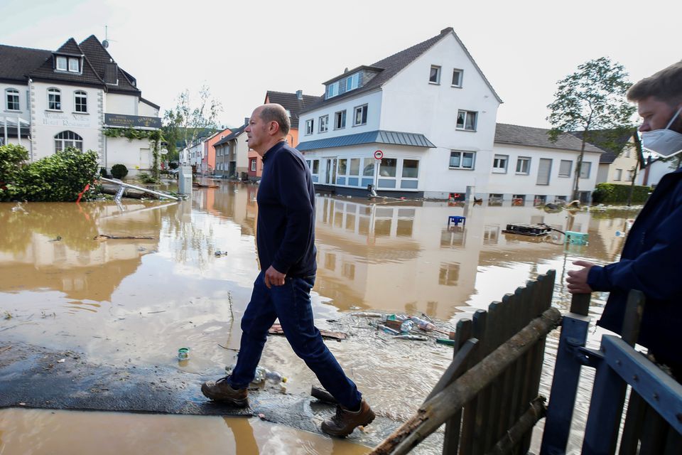 German Finance Minister Olaf Scholz visits a damaged area following heavy rainfalls in Bad Neuenahr-Ahrweiler, Germany, July 15, 2021. Photo: Reuters