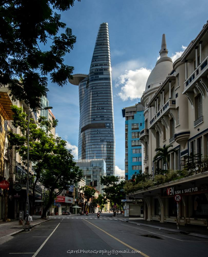 A section of once-busy Dong Khoi Street in District 1, Ho Chi Minh City has emptied due to Saigon’s latest social distancing mandate, which started on May 31, 2021. Photo: Alexandre Garel