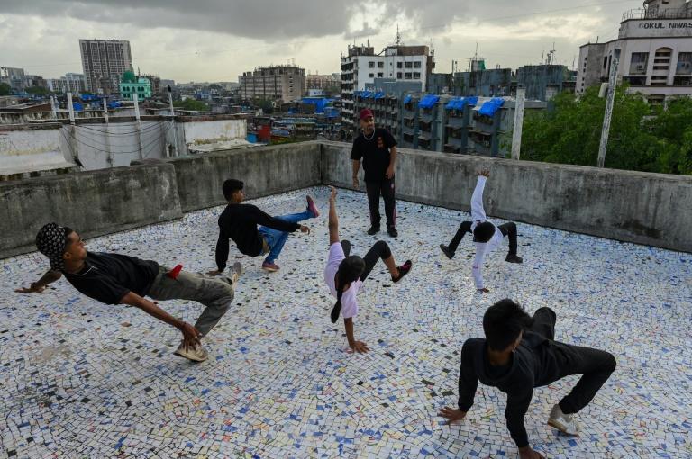 After the slum -- India's largest -- defeated the pandemic, some of its young residents pulled out their phones to write, shoot and release a triumphant rap video. Photo: AFP