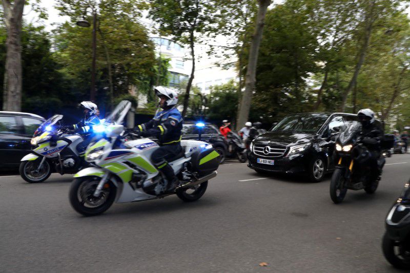 Police escort a car containing Lionel Messi as he leaves the American Hospital of Paris after medical tests for joining Paris St Germain, Paris, France - August 10, 2021. Photo: Reuters