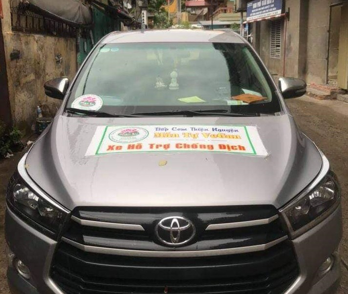 Ho Le Tan Phat’s car is marked with a poster that reads ‘Man Tu VeGan charitable kitchen - Vehicle for pandemic prevention support.’