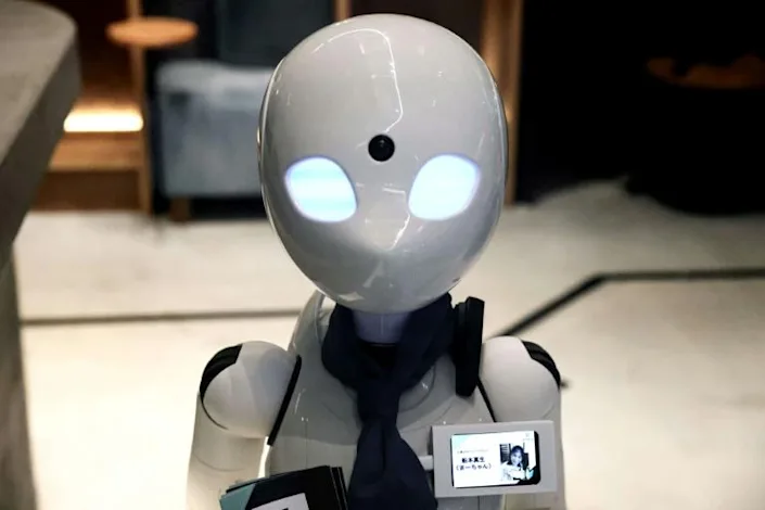 Dawn cafe's robots offer job opportunities to people who find it hard to work outside the home. Photo: AFP