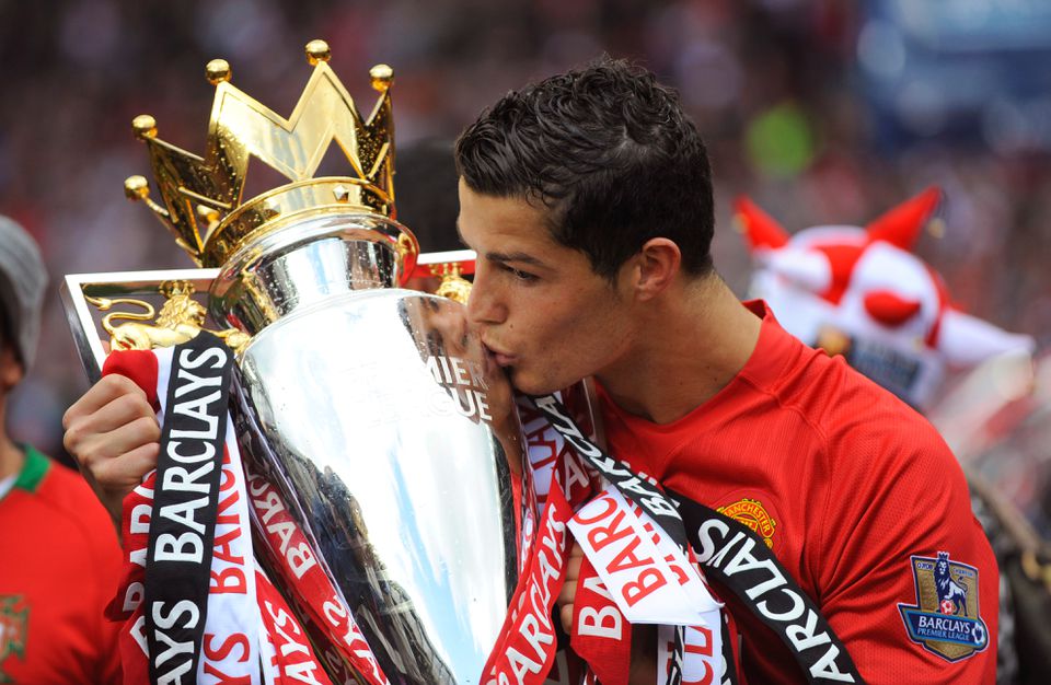 Soccer Football - Barclays Premier League - Manchester United v Arsenal - Old Trafford, Manchester, Britain - May 16, 2009 Manchester United's Cristiano Ronaldo celebrates winning the Premier League with the trophy. Action Images via Reuters/Michael Regan/File Photo
