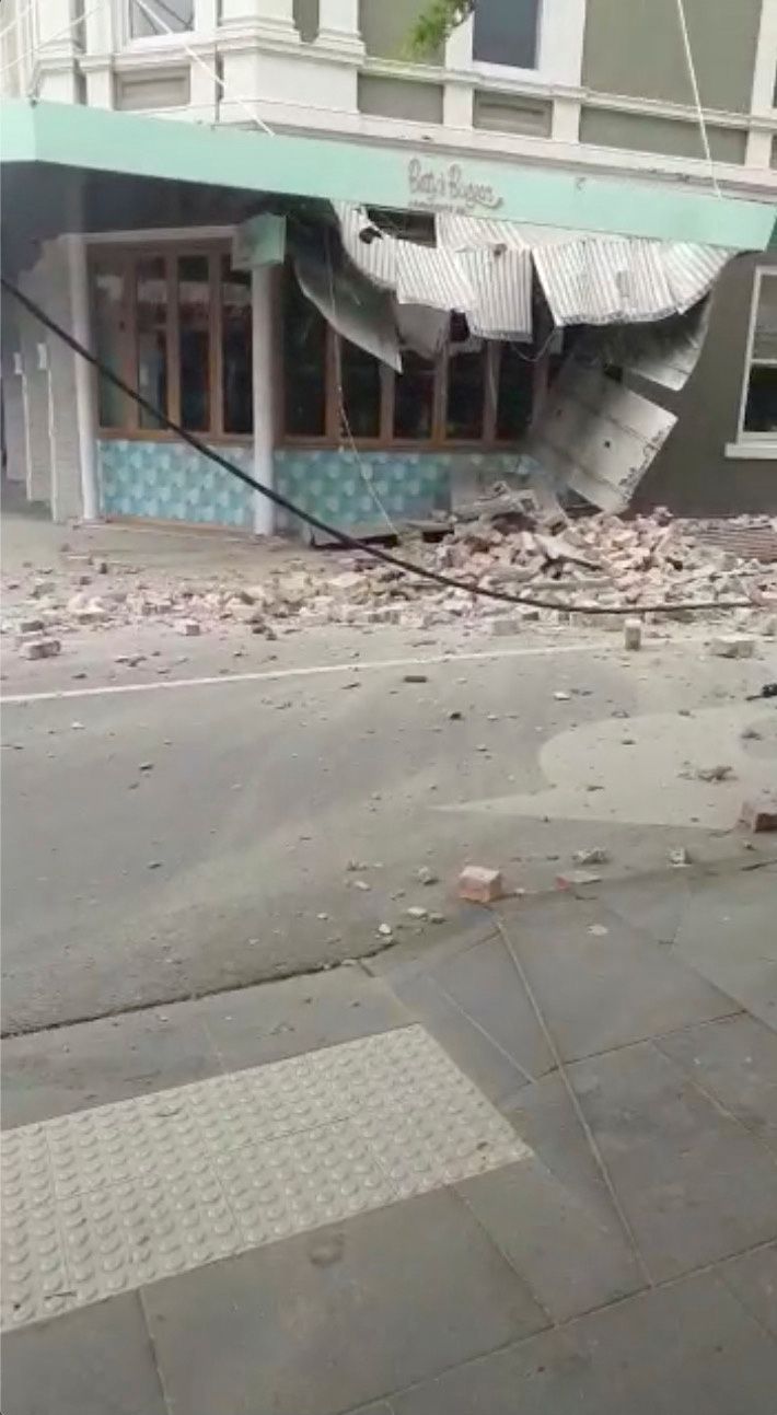 Debris and a damaged building are seen in Prahran, after a magnitude 6.0 earthquake struck near Melbourne, Victoria, Australia, September 22, 2021, in this still image from video obtained via social media. Tom Robertson via Reuters