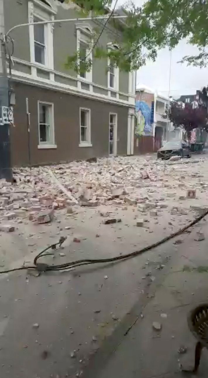 Debris are seen on a road in Prahran, after a magnitude 6.0 earthquake struck near Melbourne, Victoria, Australia, September 22, 2021, in this still image from video obtained via social media. Tom Robertson via Reuters
