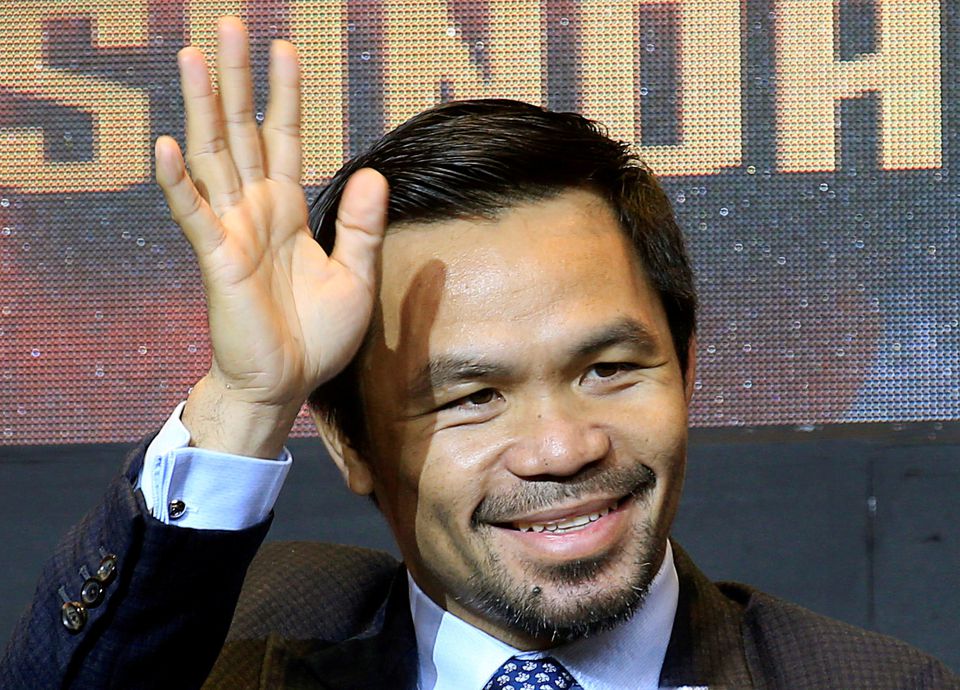 Philippine senator and boxing icon Manny 'Pacman' Pacquiao waves during a news conference with welterweight world title holder Lucas Matthysse (not pictured), for their upcoming WBA 'regular' welterweight title fight in Kuala Lumpur, Malaysia, in a hotel in Paranaque city, metro Manila, Philippines April 18, 2018.  Photo: Reuters