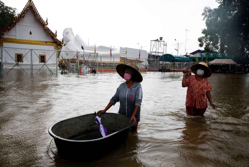 A lying Buddha statue is seen during the flood at a Temple in Ayutthaya, Thailand, October 6, 2021. Photo: Reuters