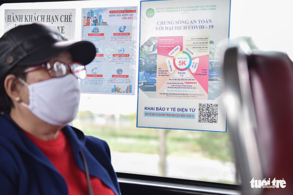 Posters promoting COVID-19 prevention measures on a bus in Ho Chi Minh City, October 5, 2021. Photo: Ngoc Phuong / Tuoi Tre