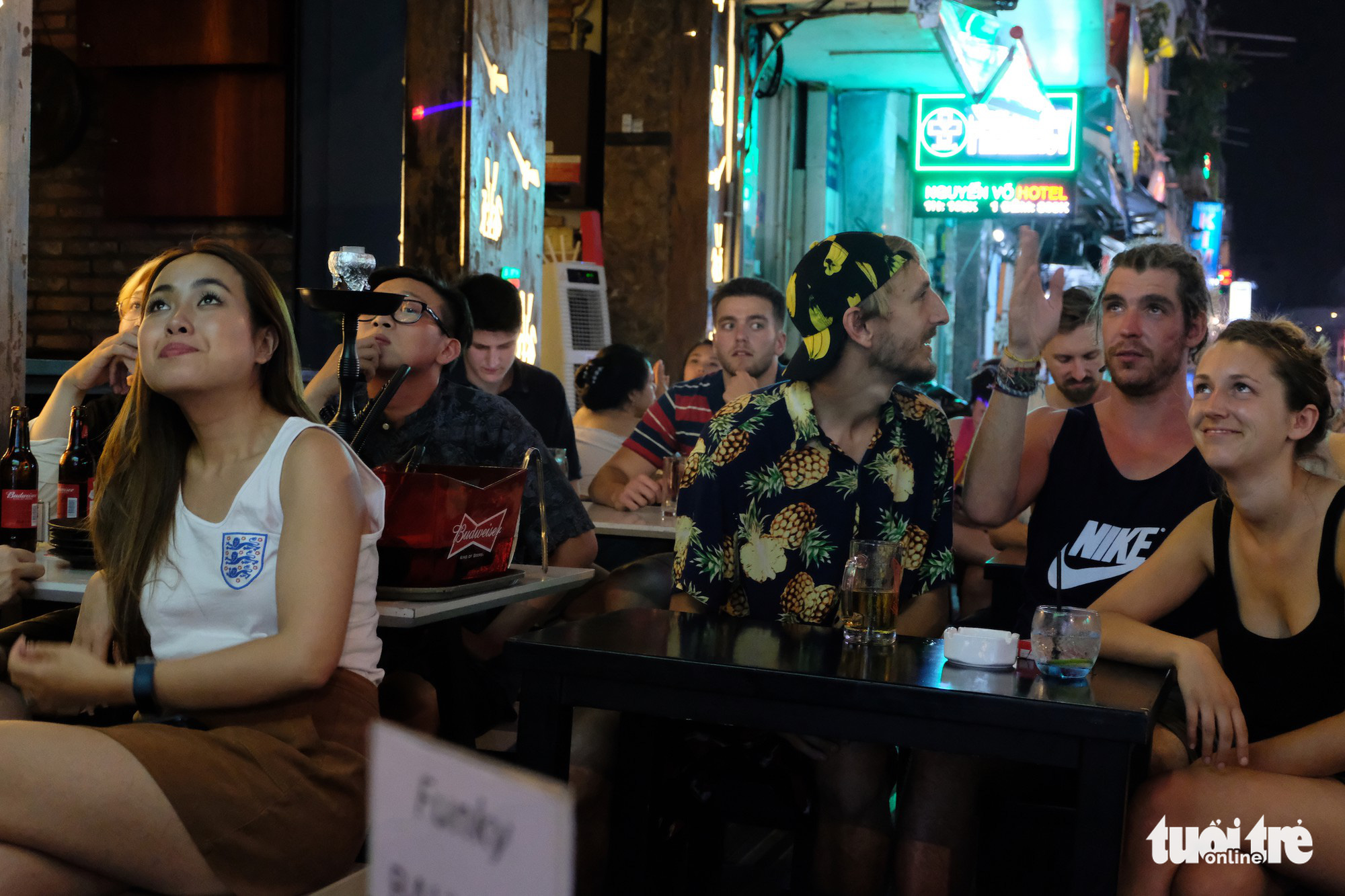 Foreigners watch a game between England and Belgium for World Cup 2018 at a bar on Ho Chi Minh City’s Bui Vien Street on June 29, 20218. Photo: Nhat Dang/ Tuoi Tre