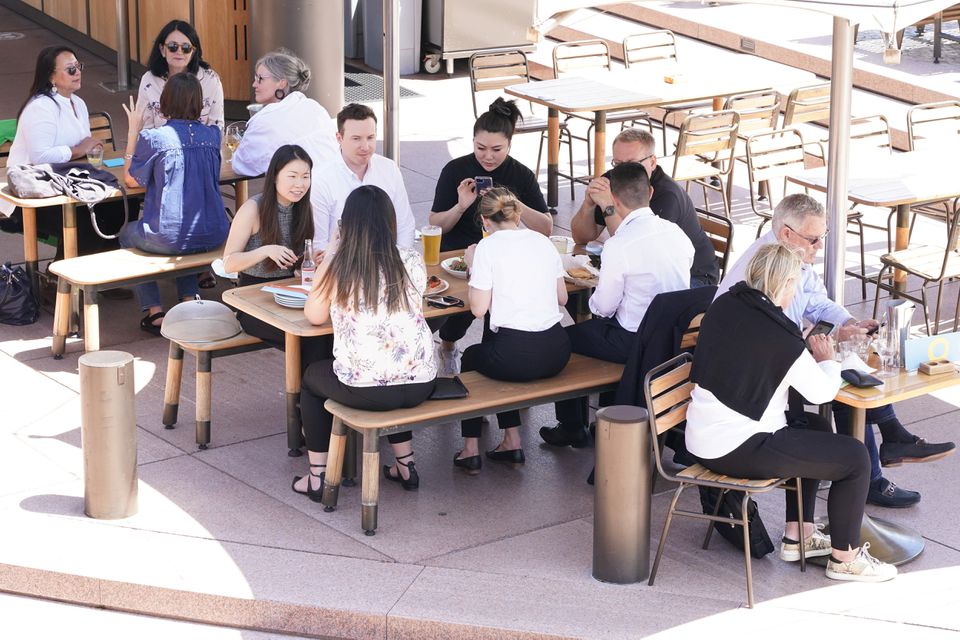 Diners enjoy a meal on the waterfront at Circular Quay in the wake of coronavirus disease (COVID-19) regulations easing, following months of lockdown orders to curb an outbreak, in Sydney, Australia, October 19, 2021. Photo: Reuters