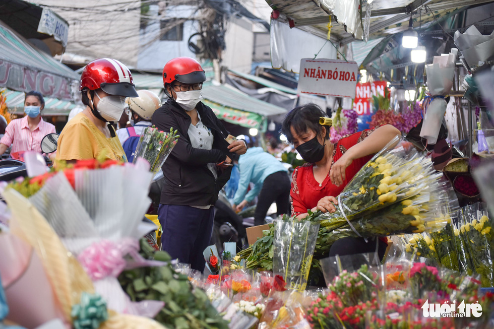 Shoppers cram Ho Chi Minh City’s biggest flower market before Vietnamese Women’s Day