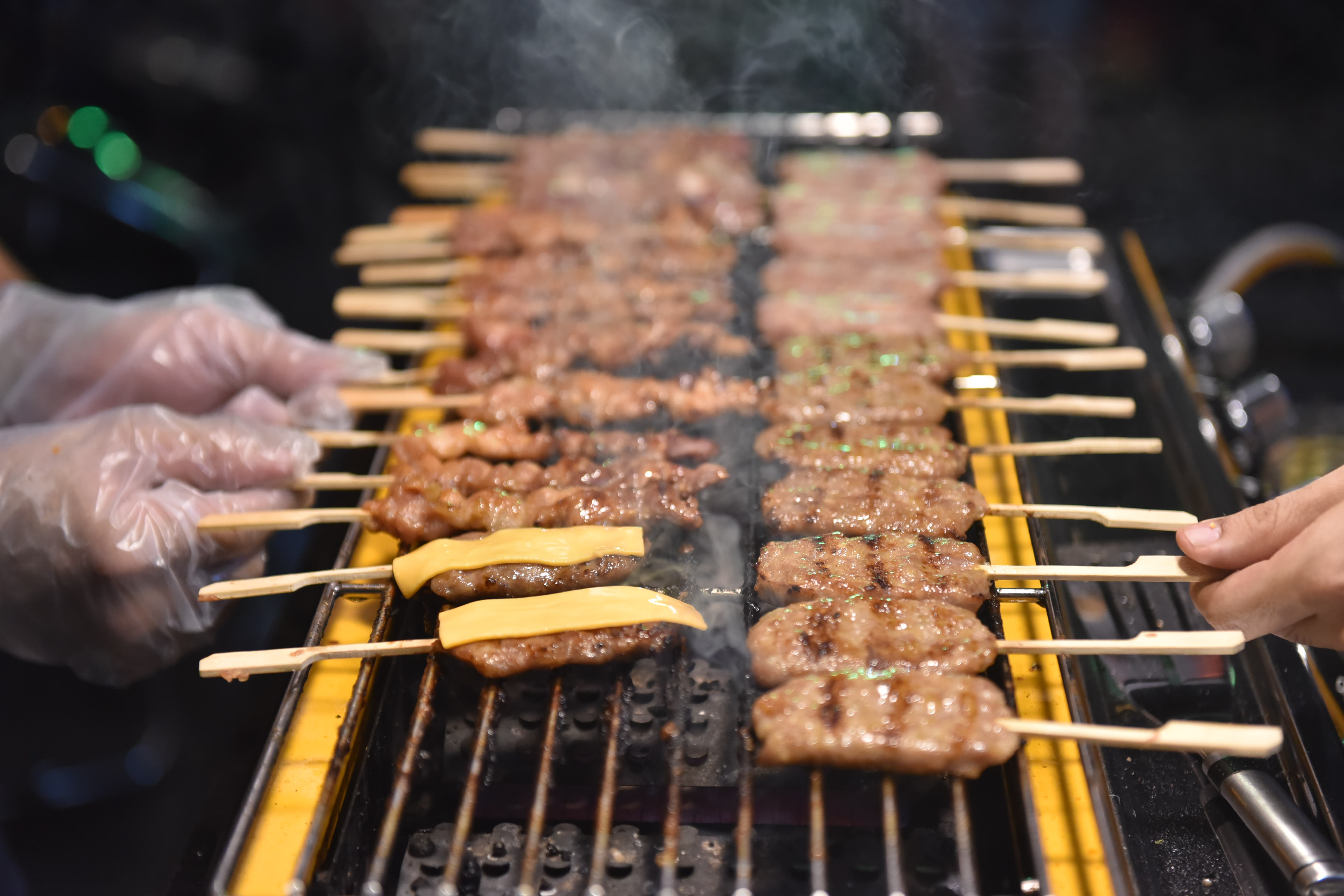 Thai-style grilled pork skewers are seen at a stall at Ho Thi Ky Food Street in Ho Chi Minh City’s District 10 on October 19, 2021. Photo: Ngoc Phuong / Tuoi Tre