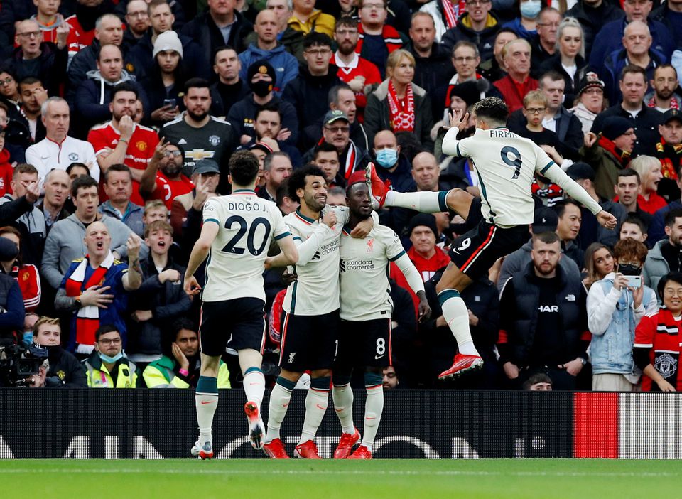 Soccer Football - Premier League - Manchester United v Liverpool - Old Trafford, Manchester, Britain - October 24, 2021 Liverpool's Naby Keita celebrates scoring their first goal with Mohamed Salah. Photo: Reuters