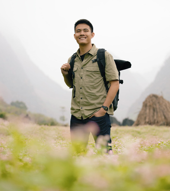 Chan La Ca in a field of 'tam giac mach,' an iconic wild flower in Ha Giang. Photo: Supplied