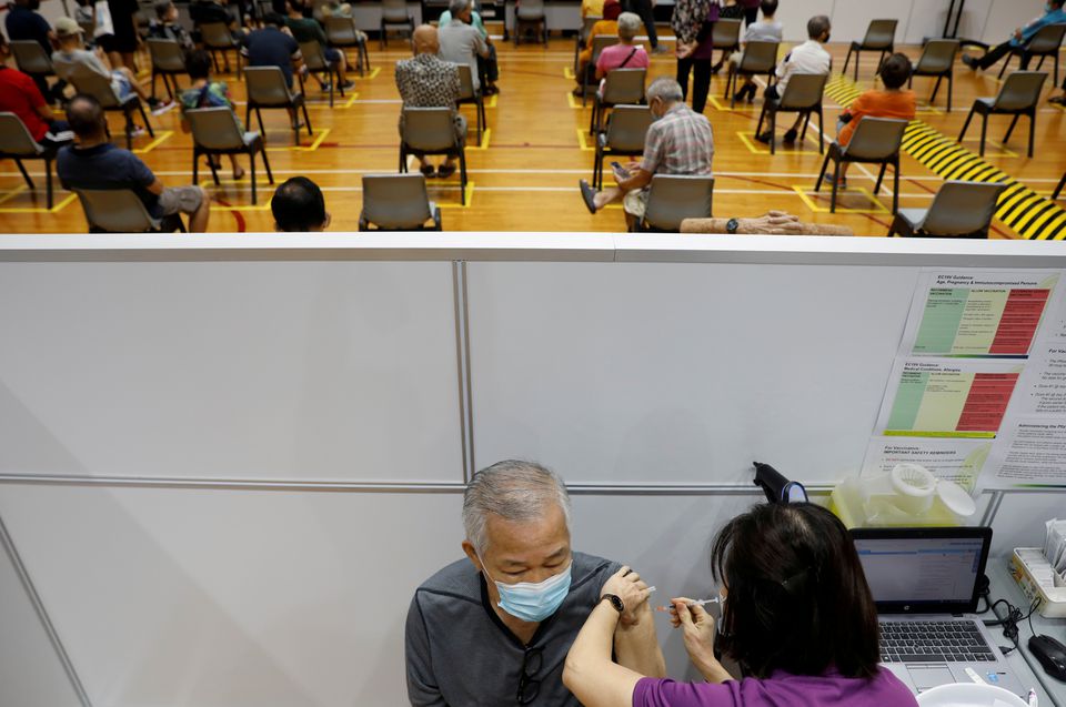 Singapore looking into unusual surge after record COVID-19 cases