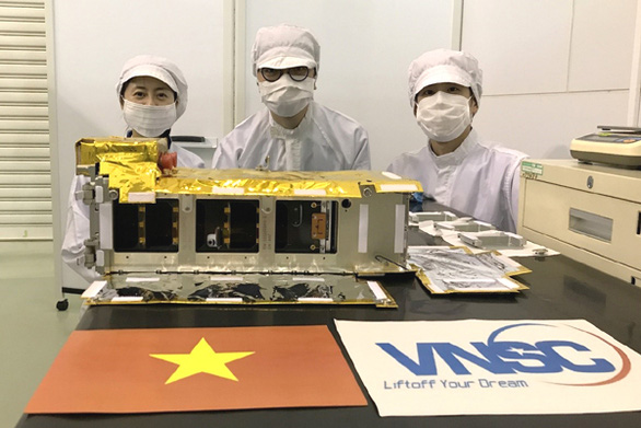 Vietnam’s NanoDragon satellite is seen when it was handed over to the Japan Aerospace Exploration Agency (JAXA). Photo: Xuan Huy / Tuoi Tre