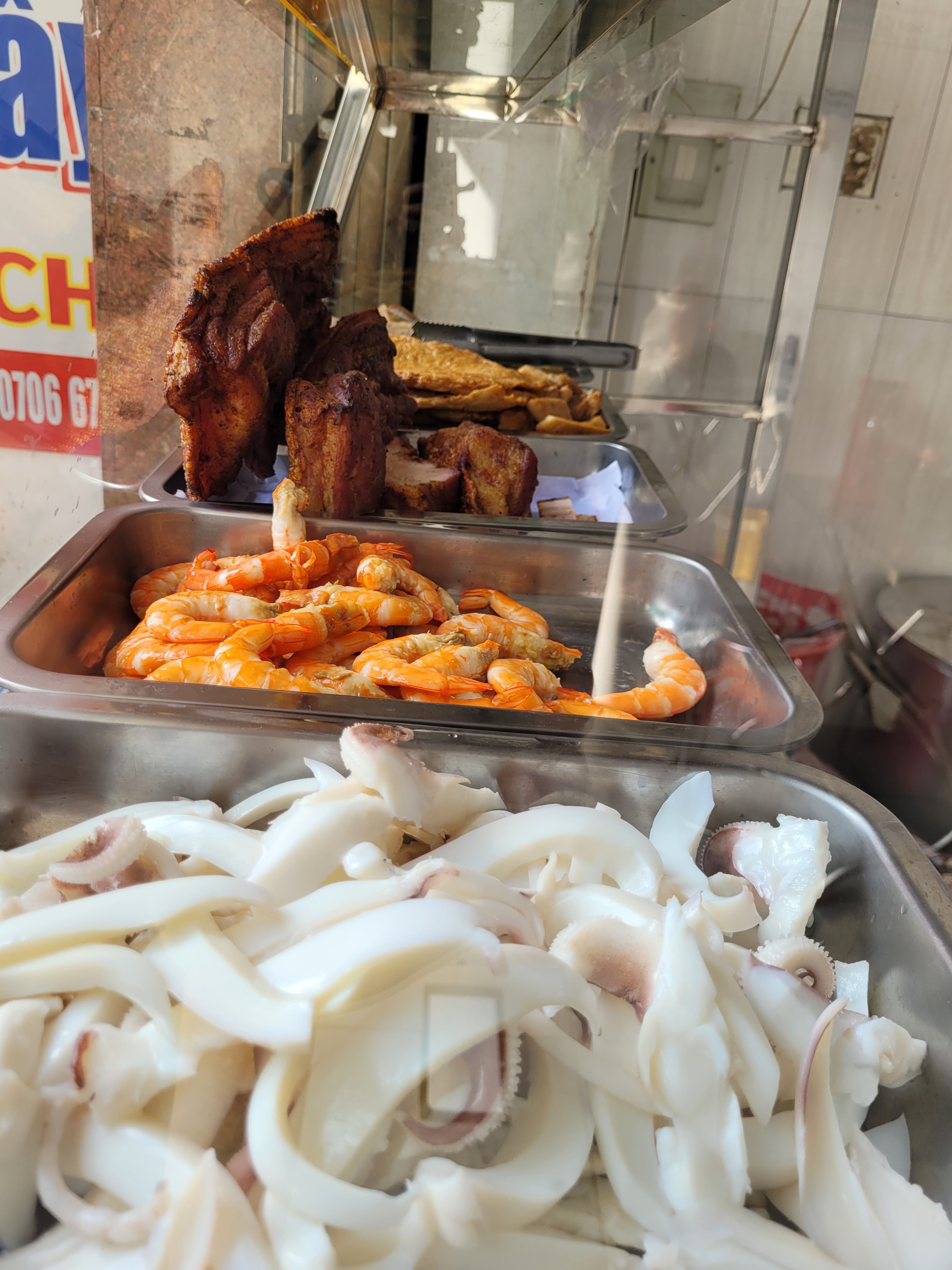 Trays of squids, shrimps and pork waiting to be served with bun mam at a restaurant in Binh Thanh District in Ho Chi Minh City. Photo: Ray Kuschert