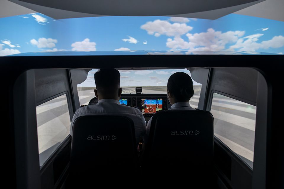 Students train in a flight simulator at the Alpha Aviation Group campus in Clark, Pampanga province, Philippines, November 3, 2021. Photo: Reuters