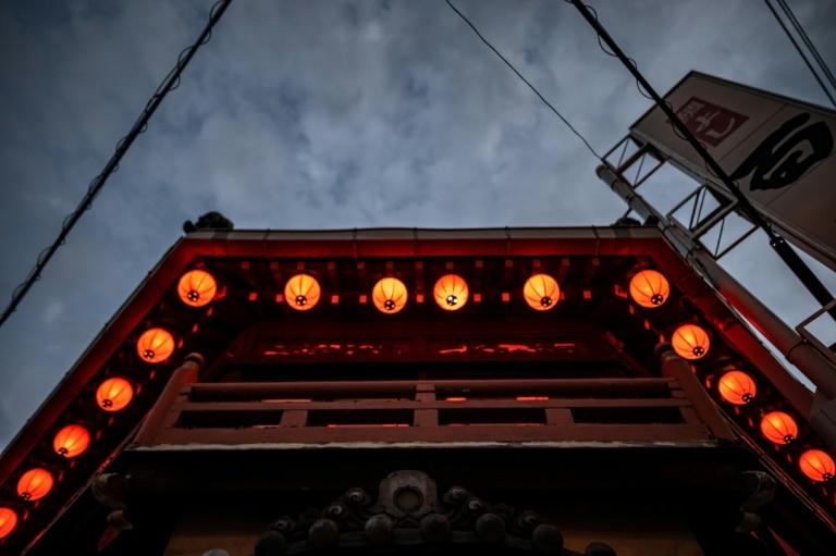 Swinging red lanterns strung along the outside of the building's second floor lend the structure a nostalgic charm. Photo: AFP