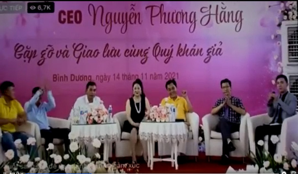 This screenshot from a video shows Nguyen Phuong Hang (center), her husband Huynh Uy Dung (third right), and her guests during a live-streamed session at Dai Nam Wonderland in Binh Duong Province, Vietnam, November 14, 2021.