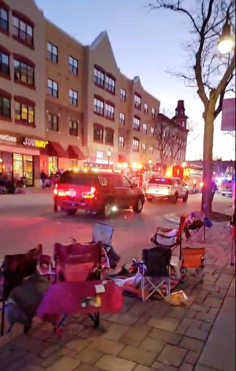 Police and emergency vehicles arrive at the scene where an SUV plowed into a Christmas parade in Waukesha, Wisconsin, U.S., in this still image taken from a November 21, 2021 social media video. Photo: JESUS OCHOA/via REUTERS