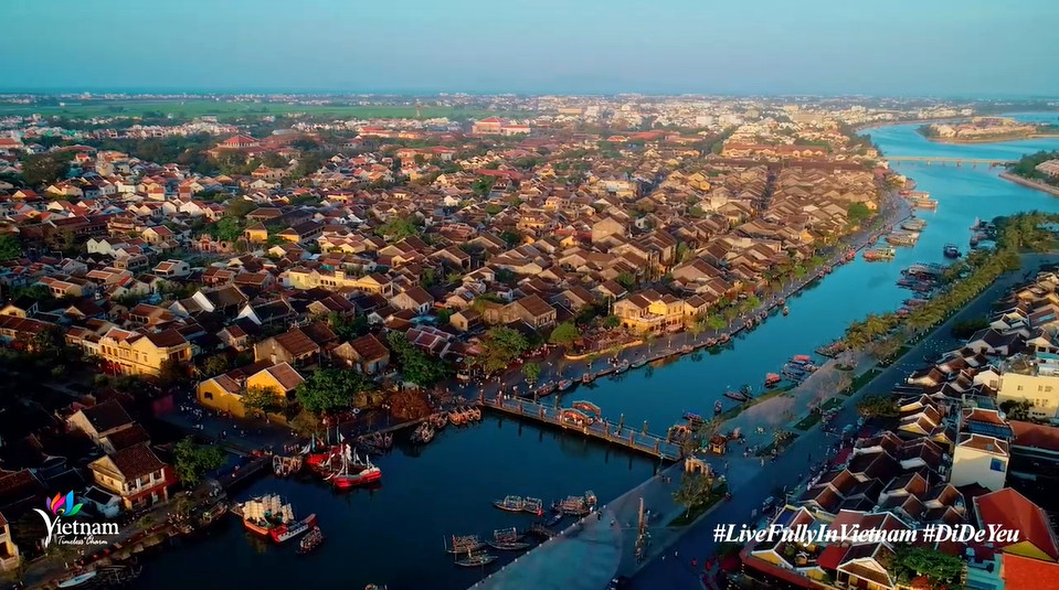 This screenshot from “Vietnam: Travel to Love! - Live fully in Vietnam” video shows a bird's-eye view of Hoi An Ancient Town, Quang Nam Province, Vietnam.