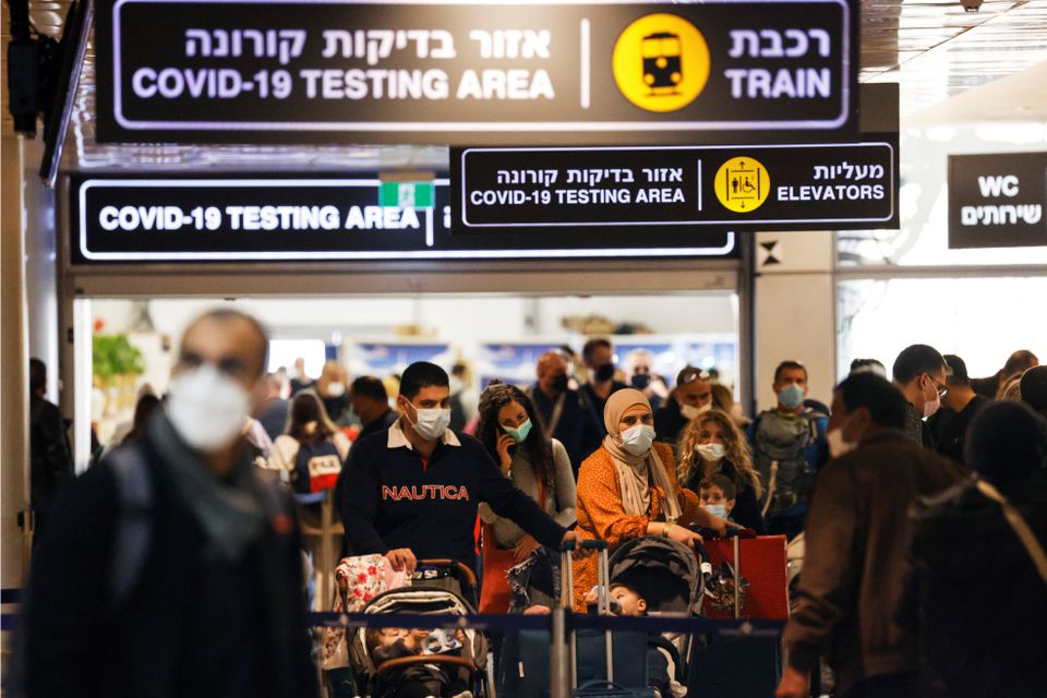 Travellers exit the coronavirus disease (COVID-19) pandemic testing area at Ben Gurion International Airport as Israel imposes new restrictions near Tel Aviv, Israel November 28, 2021. Photo: Reuters