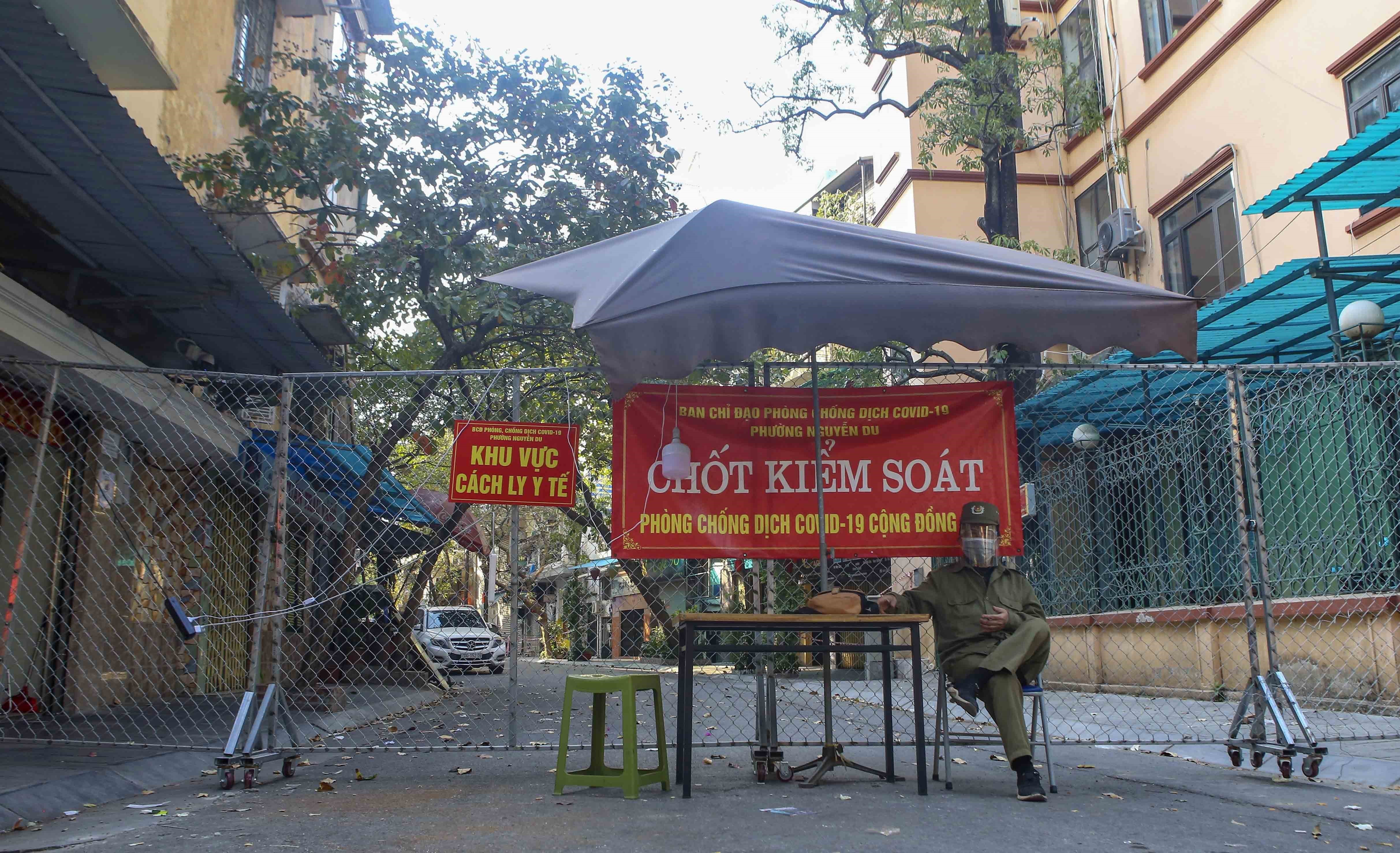 Hanoi brings back COVID-19 barriers as cases surge