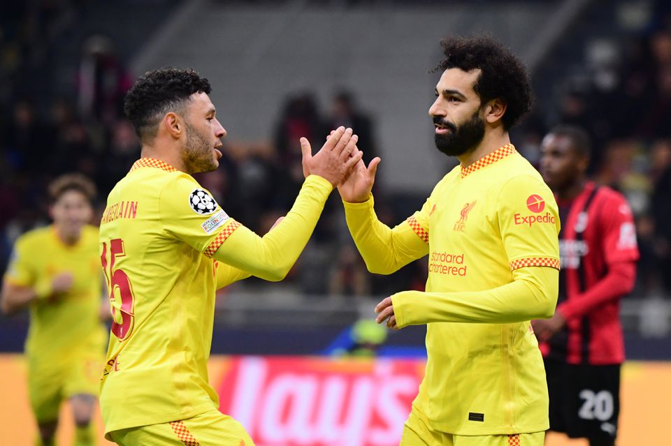 Soccer Football - Champions League - Group B - AC Milan v Liverpool - San Siro, Milan, Italy - December 7, 2021 Liverpool's Mohamed Salah celebrates scoring their first goal with Alex Oxlade-Chamberlain. Photo: Reuters