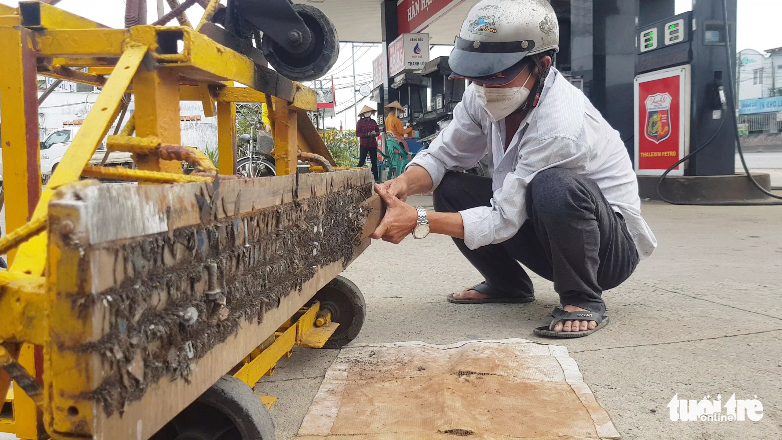 Tire-puncturing nails litter suburban road in Ho Chi Minh City
