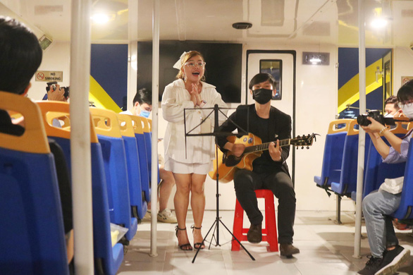 A band performs a song for passengers aboard the water bus in Ho Chi Minh City, Vietnam, December 8, 2021. Photo: Hoang An / Tuoi Tre