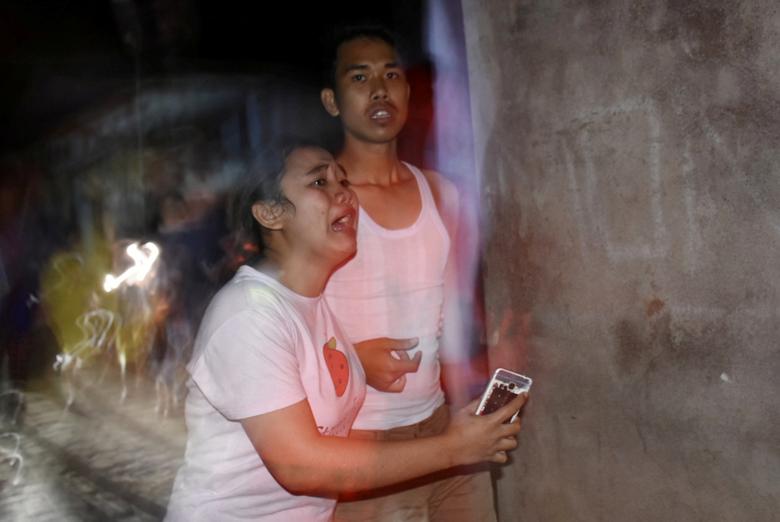 Indonesians flee homes after powerful quake prompts tsunami warning