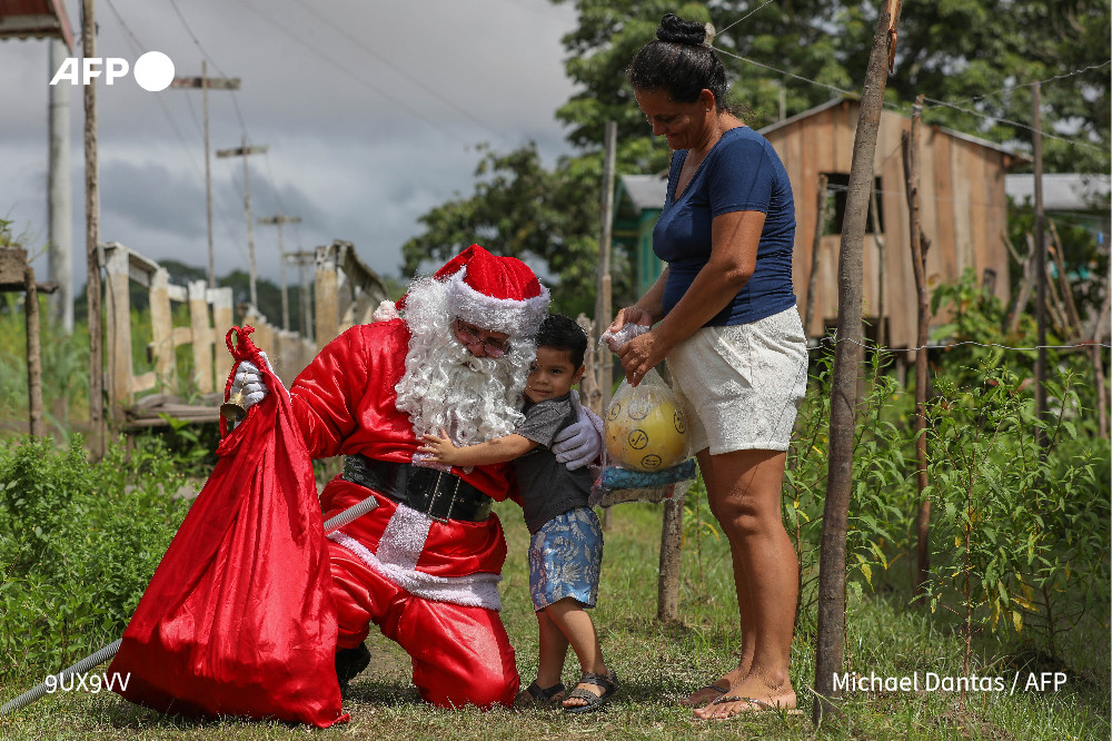 'You can't change the world, but you can make children smile at Christmastime,' Santa tells AFP. Photo: AFP