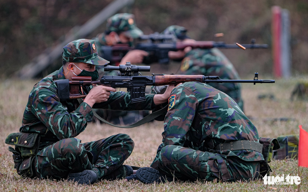 Soldiers take aim at the National Military Training Center 4 in My Duc District, Hanoi, Vietnam. Photo: Nam Tran / Tuoi Tre