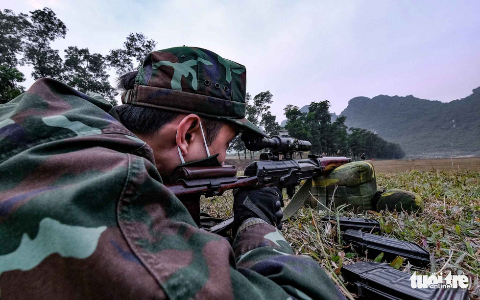 A soldier takes aim at a target during sniper training at the National Military Training Center 4 in My Duc District, Hanoi, Vietnam. Photo: Nam Tran / Tuoi Tre