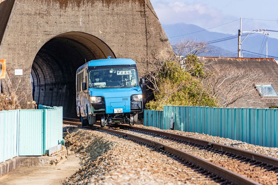 A 'Dual-Mode Vehicle (DMV)' bus that can run both on conventional road surfaces and a railway track, is seen during its test run in Kaiyo Town, Tokushima Prefectue, Japan, in this handout photo taken in March 2021 and released by Tokushima Prefectural Government, obtained by Reuters on December 24, 2021. Tokushima Prefectural Government/Handout via Reuters