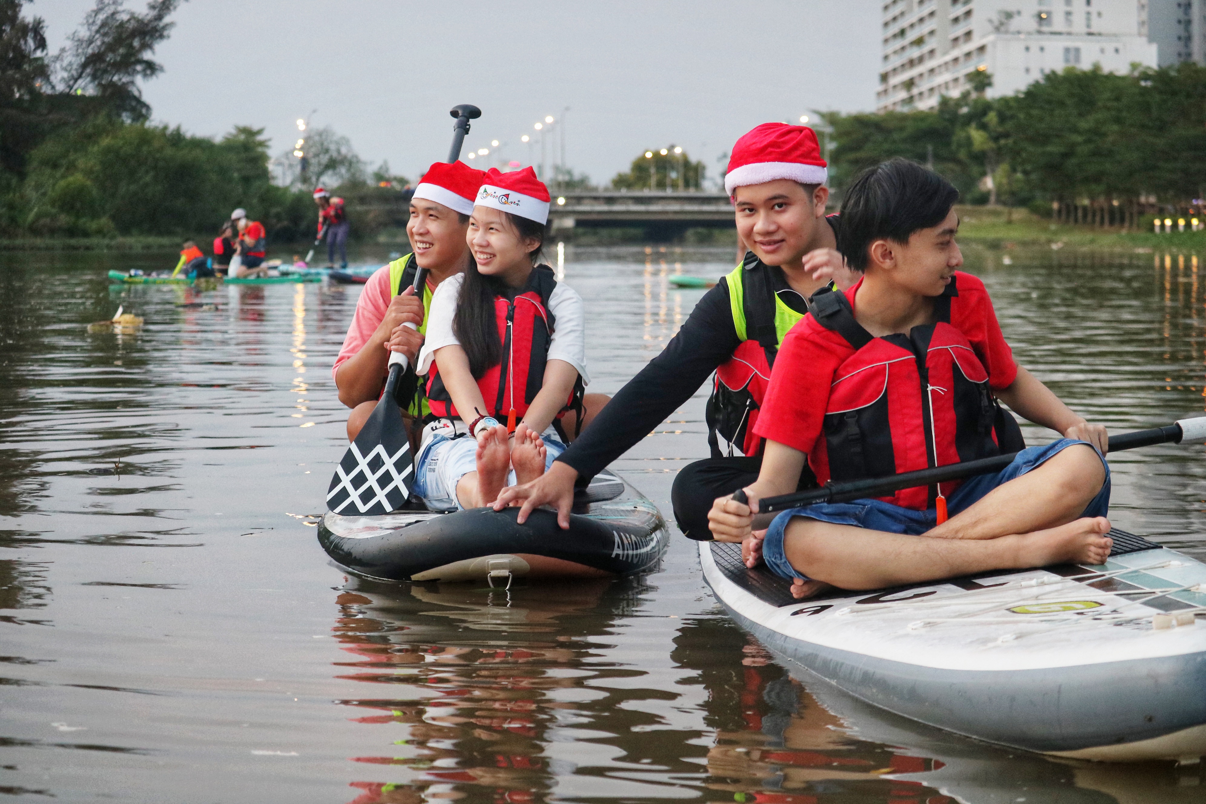 Each young paddler is accompanied by a coach to ensure safety. Photo: Hoang An / Tuoi Tre News