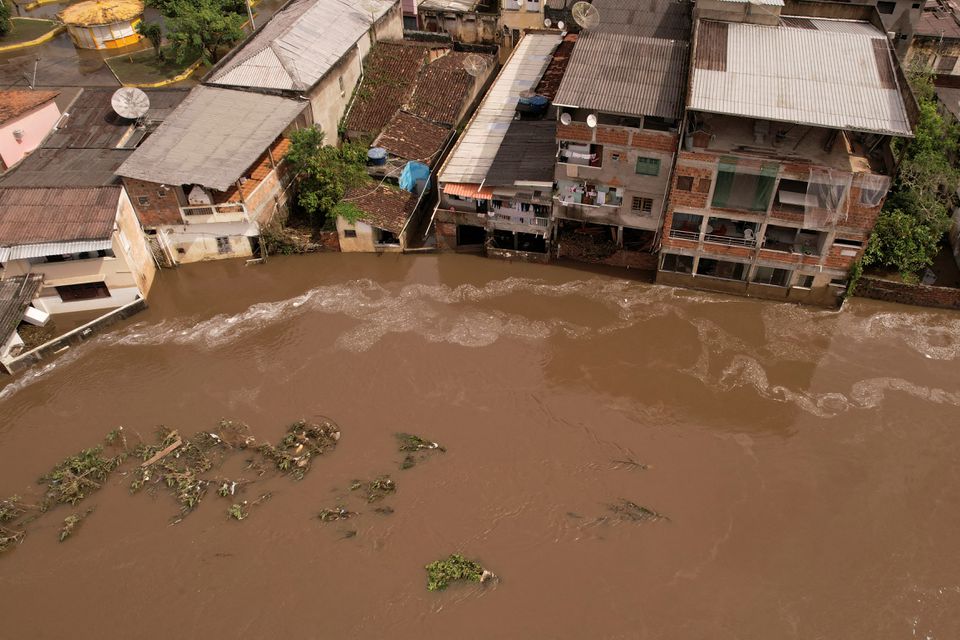 An aerial view shows a flooded street, caused due to heavy rains, in Itajuipe, Bahia state, Brazil December 27, 2021. Picture taken with a drone. Photo: Reuters