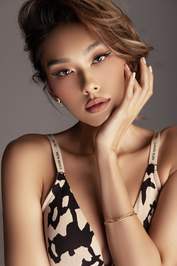 Thao Nhi Le modeling a Calvin Klein bra.