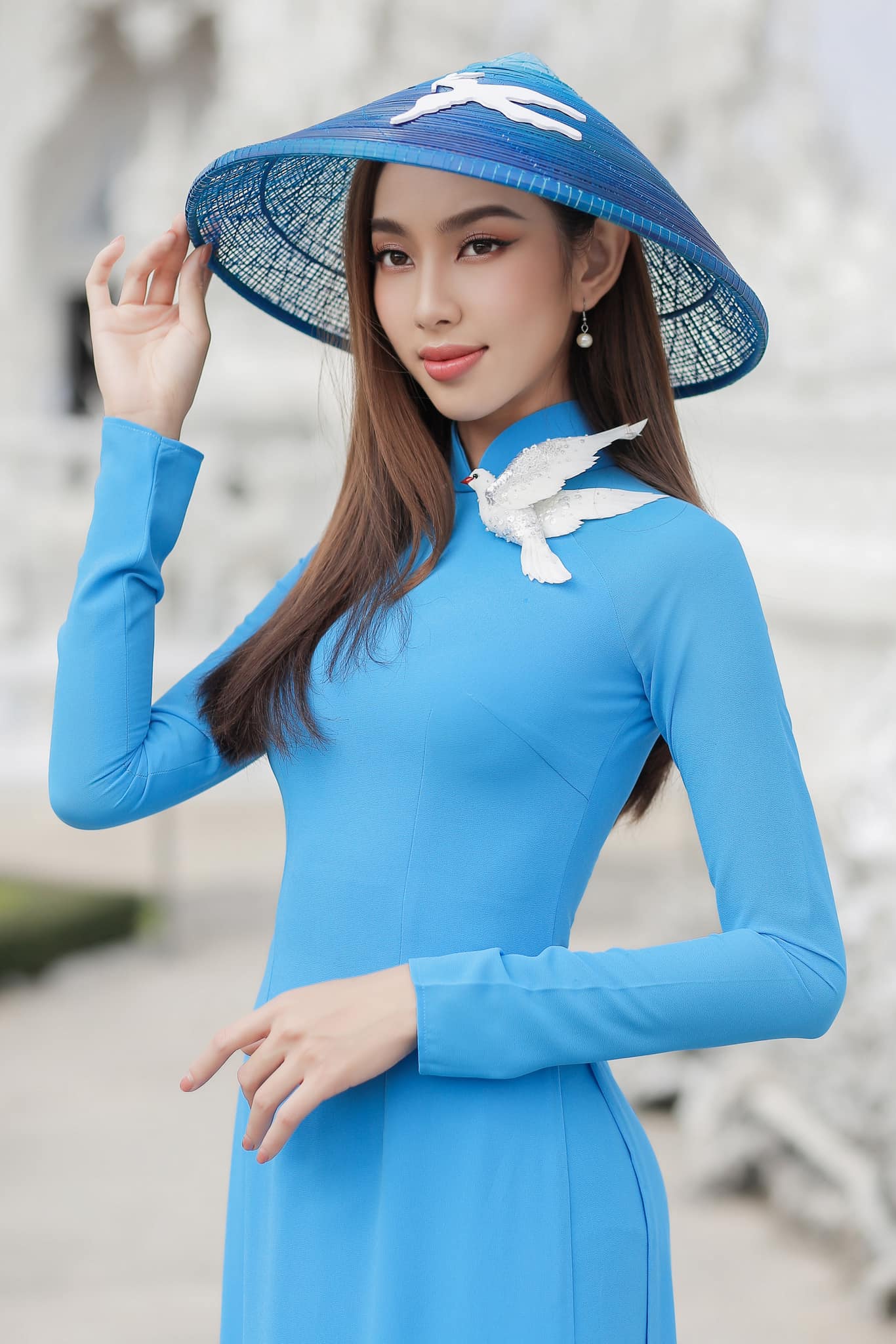 Nguyen Thuc Thuy Tien is seen wearing ao dai (Vietnamese traditional costume) and poses in a photo for a peace-themed series she posted on her verified Facebook page.