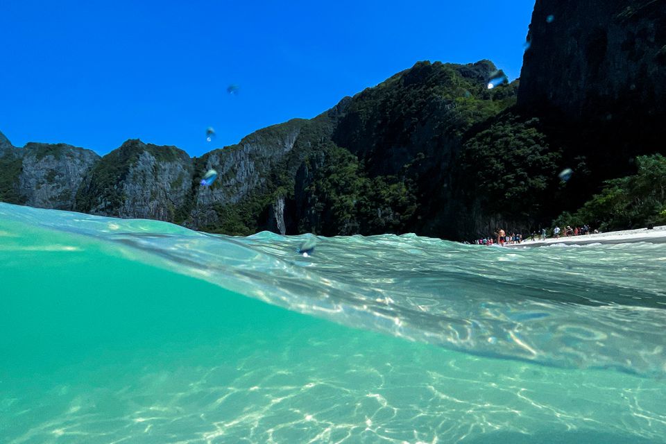 Tourists visit Maya Bay as Thailand reopens its world-famous beach after closing it for more than three years to allow its ecosystem to recover from the impact of overtourism, at Krabi province, Thailand, January 3, 2022. Photo: Reuters