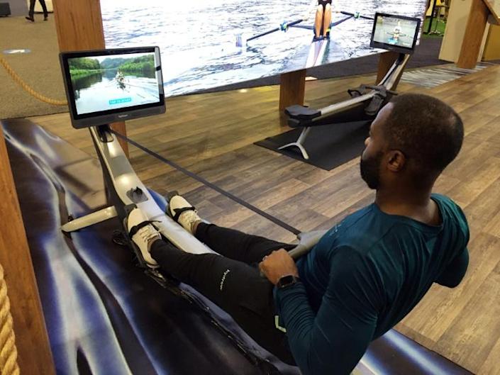 Aquil Abdullah, an employee of the Hydrow rowing fitness company, demonstrates a rowing machine at the CES technology show in Las Vegas on January 7, 2022. Photo: AFP