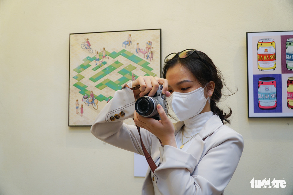 A photography enthusiast pays a visit with her camera to the Cantonese Assembly Hall in Hanoi. Photo: Nguyen Hien / Tuoi Tre