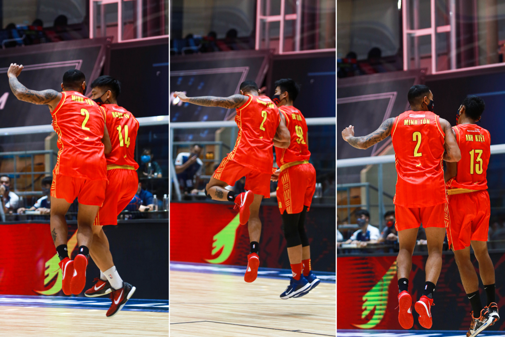 Richard Nguyen (L) of the Vietnamese national basketball team celebrates with his teammate. Photo: VBA
