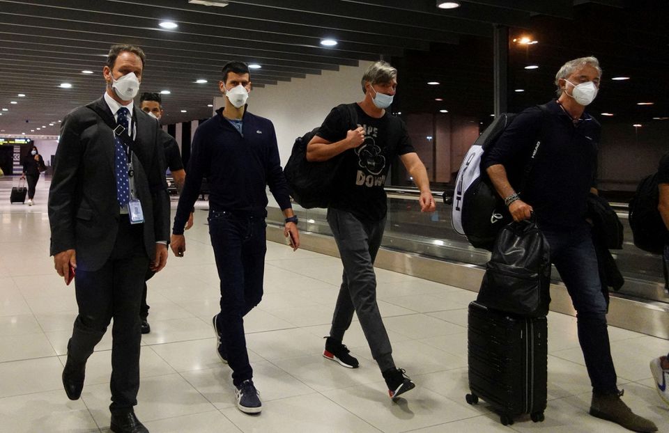 Serbian tennis player Novak Djokovic walks in Melbourne Airport before boarding a flight, after the Federal Court upheld a government decision to cancel his visa to play in the Australian Open, in Melbourne, Australia, January 16, 2022. Photo: Reuters